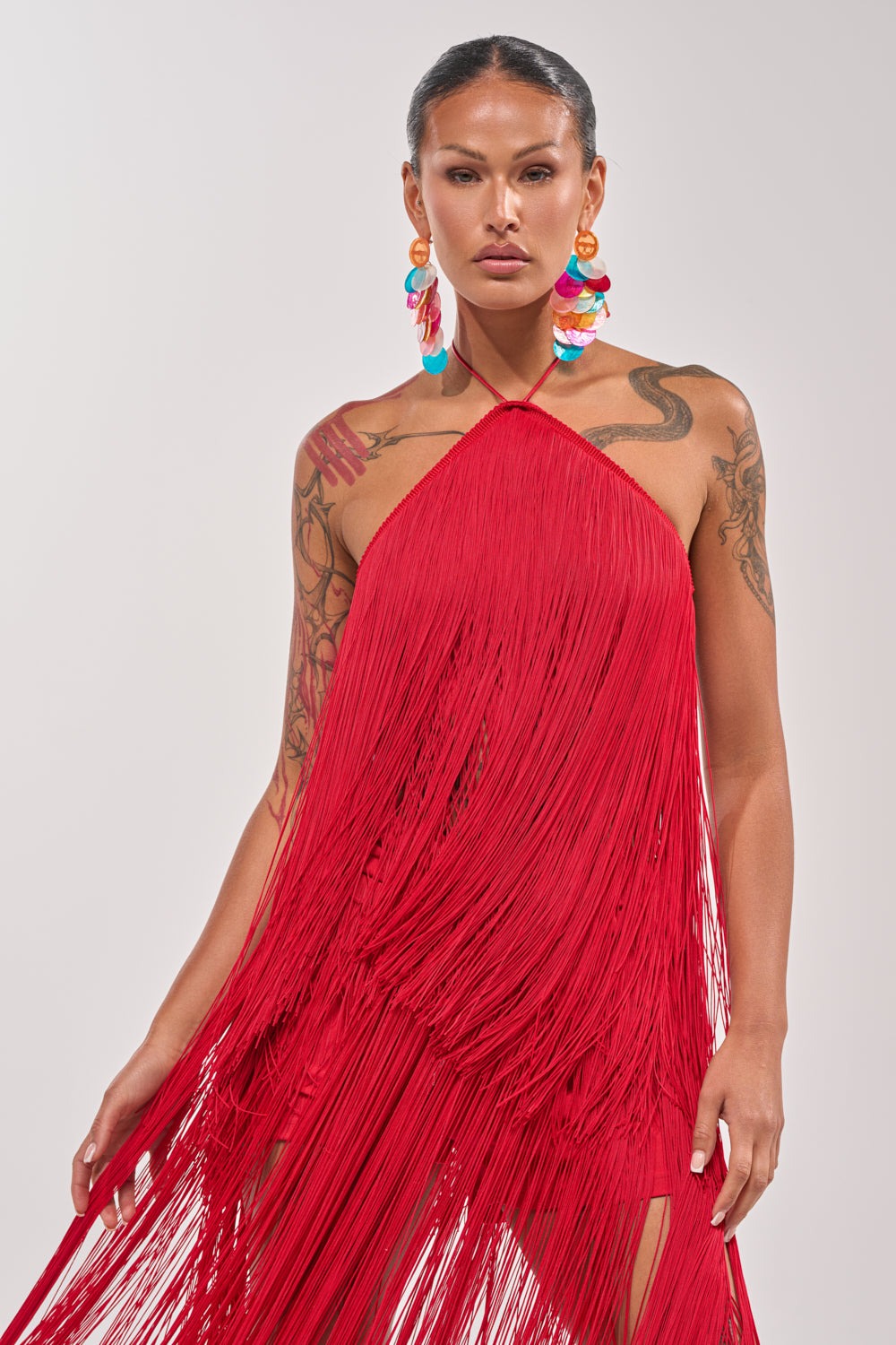 ON THE EDGE FRINGE HALTER TOP